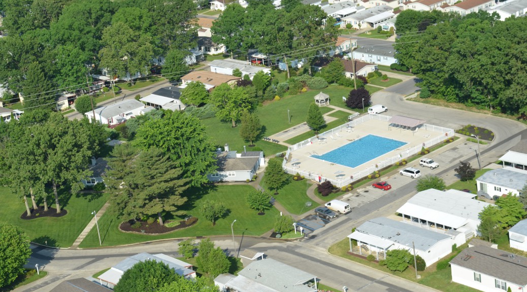 aerial view of community and Olympic size pool